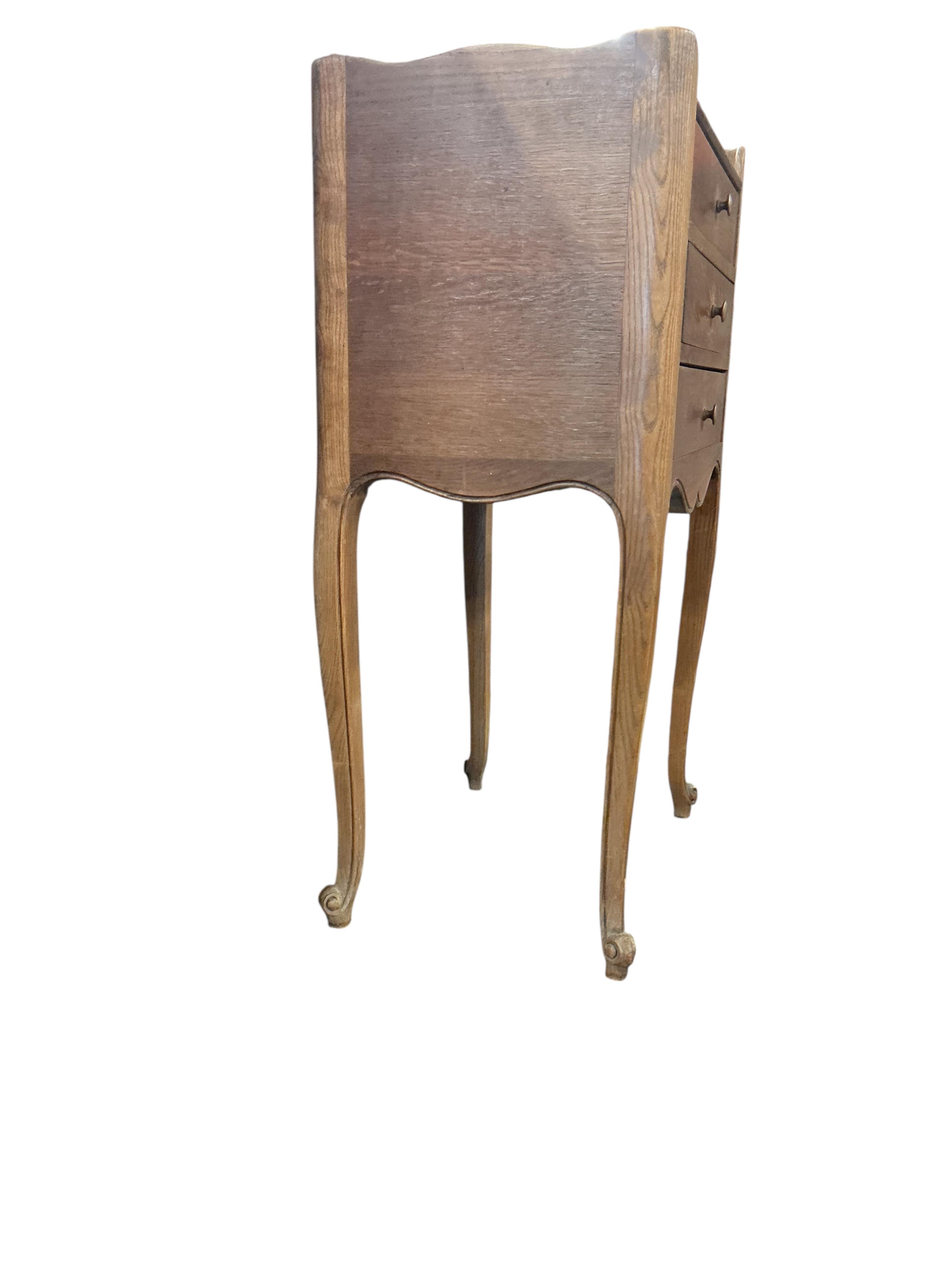 An early 20th century French oak tray top bedside chest, width 43cm, depth 32cm, height 77cm